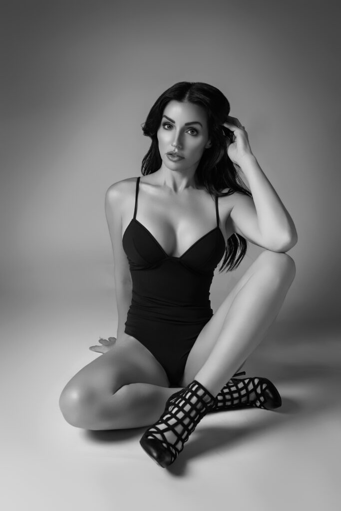 Boudoir photo featuring a woman over 40 styled in natural light and shadows.